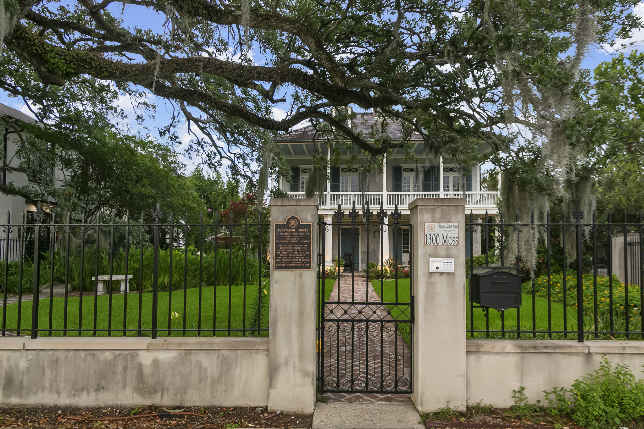 Oak canopy and stone pillars along a walking path in City Park near Bayou St. John, New Orleans